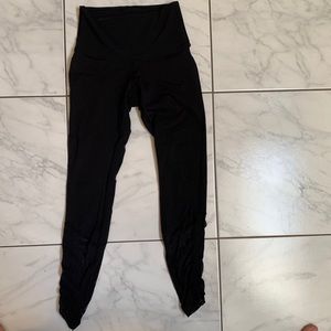 Black Lululemon leggings with adjustable mesh